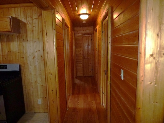 29119 Day Rd, Mcarthur, CA 96056 - corridor featuring wood walls, washer / dryer, and light wood finished floors