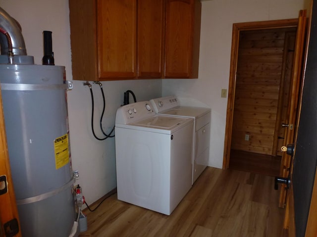 29119 Day Rd, Mcarthur, CA 96056 - laundry area with secured water heater, light wood-type flooring, separate washer and dryer, and cabinet space