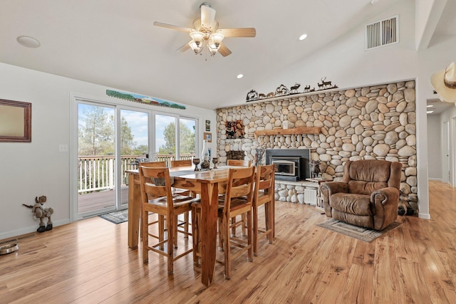6949 Rector Creek Rd, Igo, CA 96047 - dining area with ceiling fan, light wood-type flooring, high vaulted ceiling, recessed lighting, and a wood stove