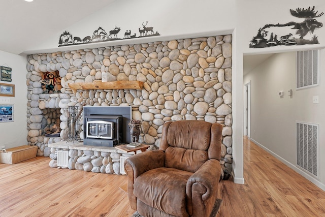 6949 Rector Creek Rd, Igo, CA 96047 - sitting room with wood finished floors, lofted ceiling, and a wood stove