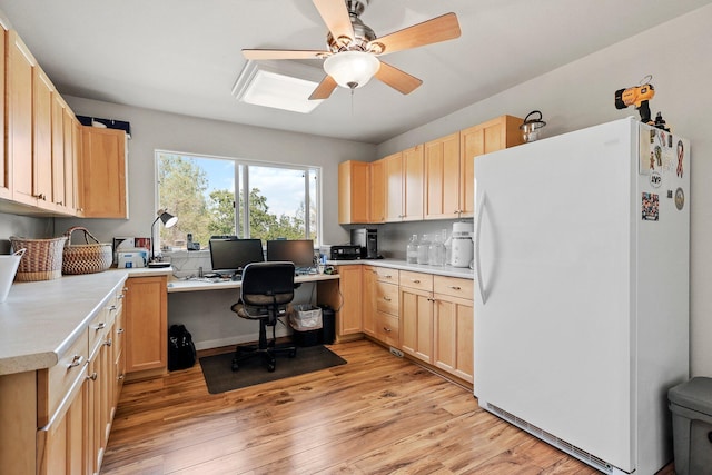 6949 Rector Creek Rd, Igo, CA 96047 - office area featuring a ceiling fan, light wood-style flooring, and built in desk
