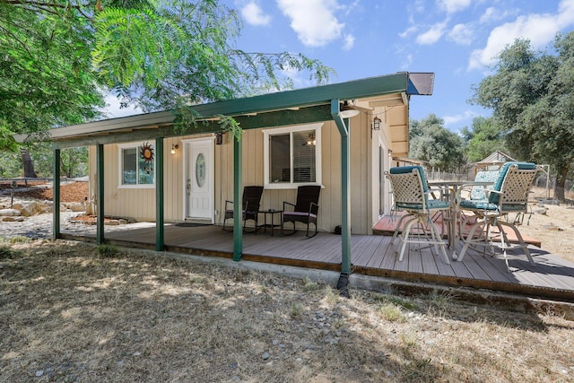 6949 Rector Creek Rd, Igo, CA 96047 - rear view of house featuring a deck, an outdoor structure, and outdoor dining area