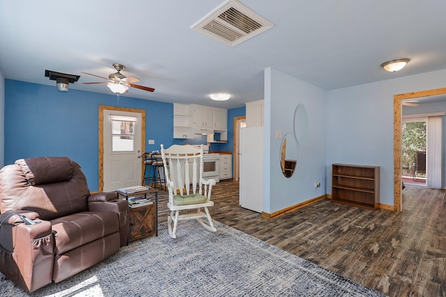 6949 Rector Creek Rd, Igo, CA 96047 - living room featuring ceiling fan and dark wood finished floors