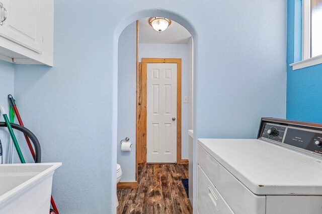 6949 Rector Creek Rd, Igo, CA 96047 - washroom with arched walkways, dark wood finished floors, a textured wall, and cabinet space