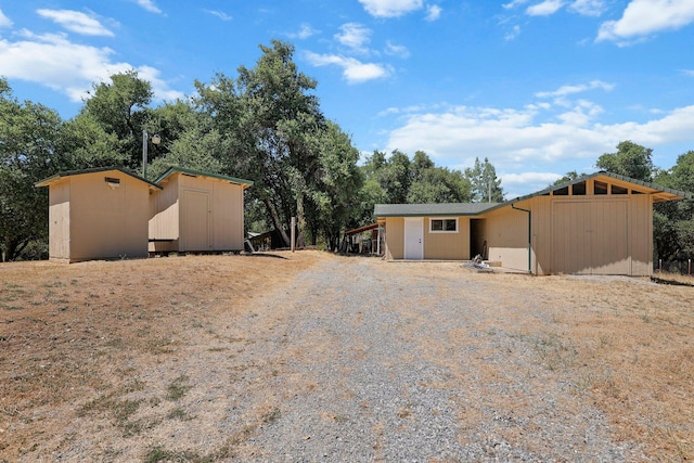 6949 Rector Creek Rd, Igo, CA 96047 - view of front of house featuring a storage shed and view of wooded area