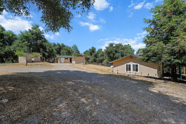 6949 Rector Creek Rd, Igo, CA 96047 - view of yard with a storage unit and view of scattered trees