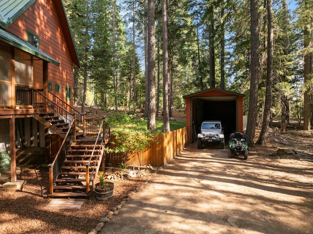 8637 Savannah Way, Shingletown, CA 96088 - view of home's exterior featuring driveway, stairs, and an outbuilding