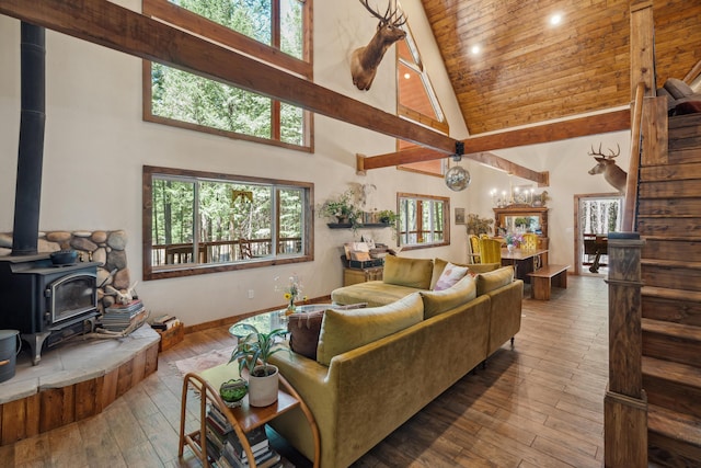 8637 Savannah Way, Shingletown, CA 96088 - living area with high vaulted ceiling, a wood stove, healthy amount of natural light, recessed lighting, and wood-type flooring