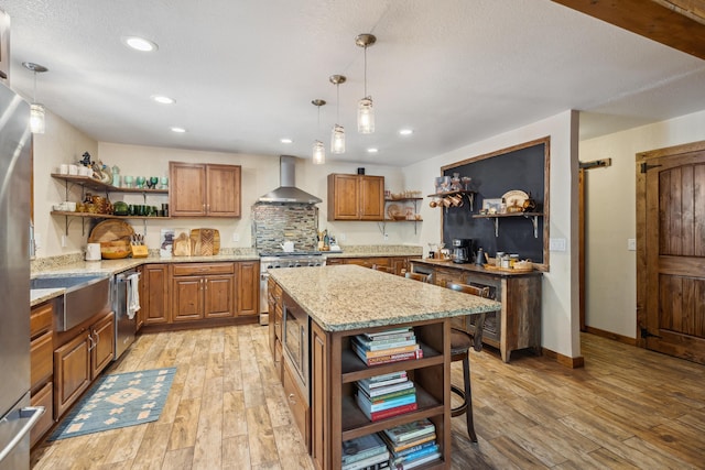 8637 Savannah Way, Shingletown, CA 96088 - kitchen featuring open shelves, wall chimney exhaust hood, stainless steel appliances, brown cabinets, and light wood-style floors