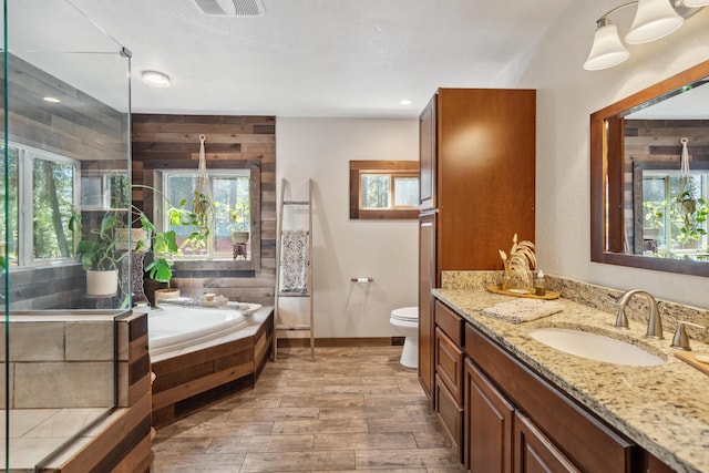 8637 Savannah Way, Shingletown, CA 96088 - bathroom with vanity, a garden tub, and wood finished floors