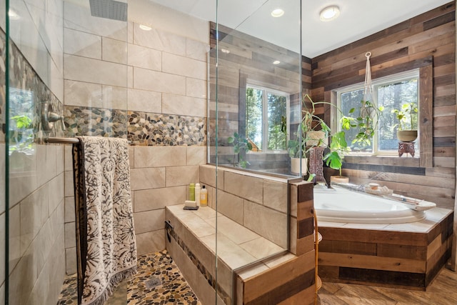 8637 Savannah Way, Shingletown, CA 96088 - bathroom featuring a tile shower, a garden tub, tile walls, recessed lighting, and wood finished floors