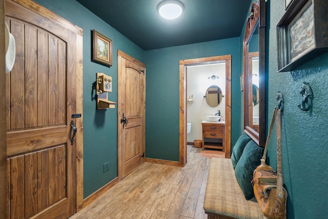 8637 Savannah Way, Shingletown, CA 96088 - entrance foyer featuring light wood-type flooring and a textured wall