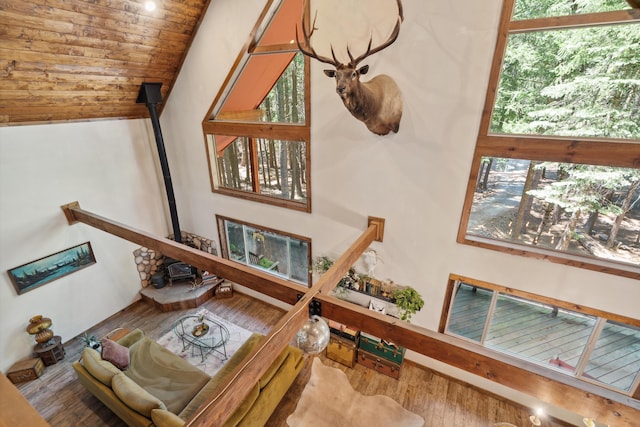 8637 Savannah Way, Shingletown, CA 96088 - living room with a wood stove, wood finished floors, and vaulted ceiling