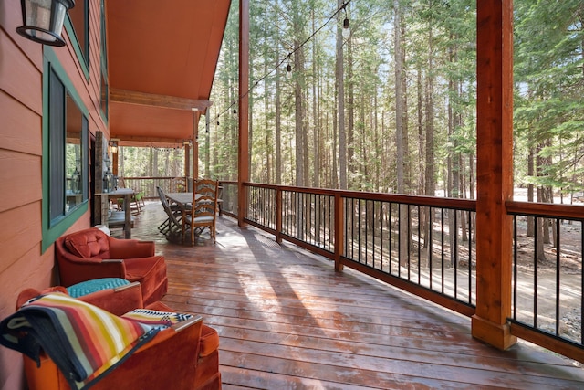 8637 Savannah Way, Shingletown, CA 96088 - wooden terrace with outdoor dining space and a forest view