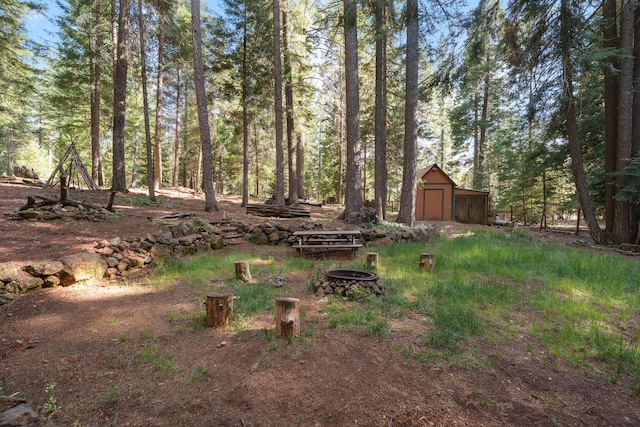 8637 Savannah Way, Shingletown, CA 96088 - view of yard featuring an outdoor fire pit and an outbuilding
