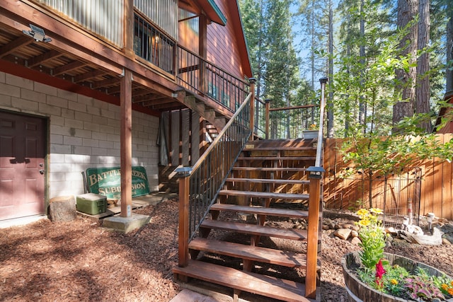 8637 Savannah Way, Shingletown, CA 96088 - property entrance with concrete block siding and a wooden deck