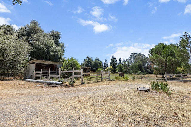 20822 Clough Creek Rd, Redding, CA 96002 - view of yard featuring an exterior structure, an outdoor structure, and a view of rural / pastoral area