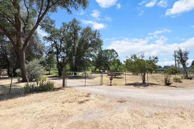 20822 Clough Creek Rd, Redding, CA 96002 - view of dirt / gravel road with a gate