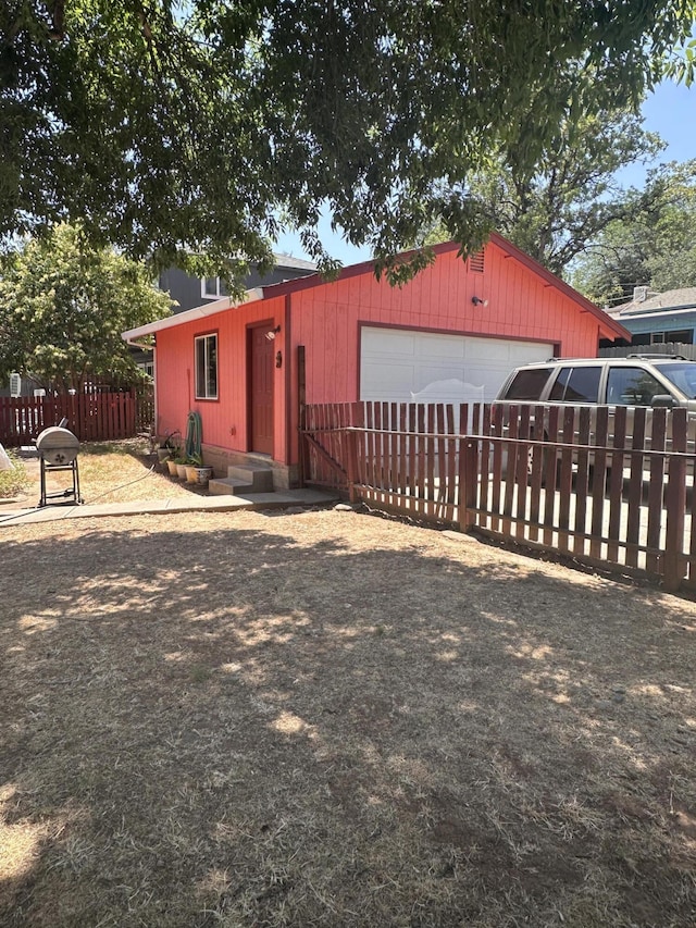 1310 Olive St, Redding, CA 96001 - ranch-style home featuring an outdoor structure and a garage
