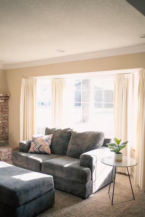3060 Monte Bello Dr, Redding, CA 96001 - living room featuring carpet and crown molding