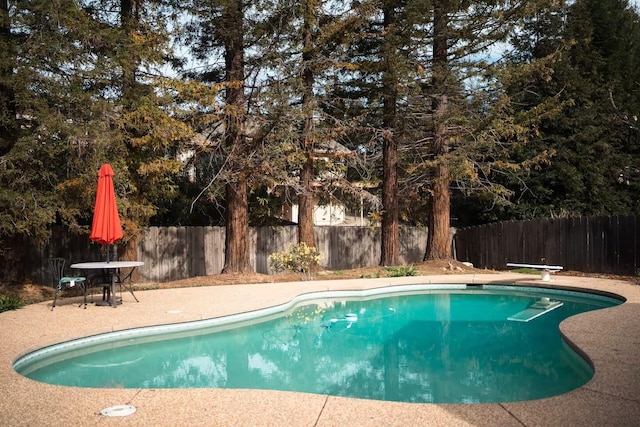 3060 Monte Bello Dr, Redding, CA 96001 - view of pool with a fenced backyard, a diving board, and a patio