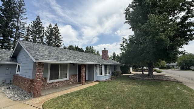 3060 Monte Bello Dr, Redding, CA 96001 - ranch-style house featuring a chimney, a front lawn, and a shingled roof