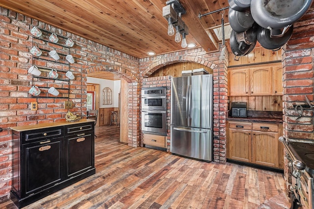 30303 Fremont Way, Oak Run, CA 96069 - kitchen with appliances with stainless steel finishes, wooden ceiling, brick wall, light wood-style flooring, and dark countertops