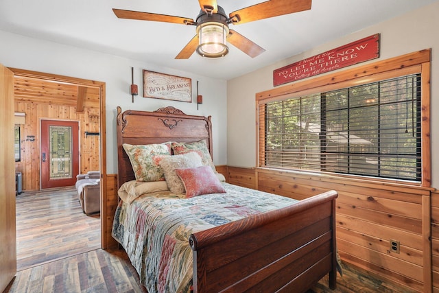 30303 Fremont Way, Oak Run, CA 96069 - bedroom featuring wood finished floors, wooden walls, and a ceiling fan