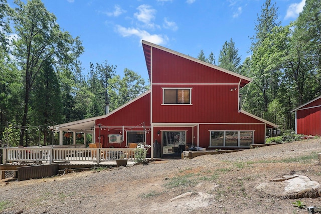 30303 Fremont Way, Oak Run, CA 96069 - back of property with a barn, a deck, and an outbuilding