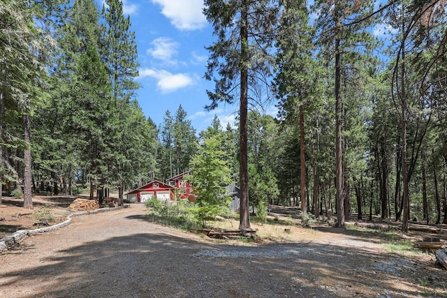 30303 Fremont Way, Oak Run, CA 96069 - view of front facade featuring driveway and a view of trees