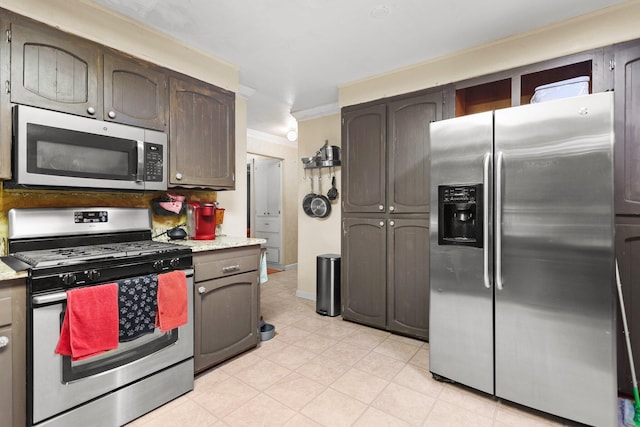 20106 Bonita Way, Redding, CA 96002 - kitchen with appliances with stainless steel finishes, light countertops, and ornamental molding