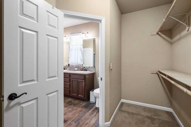 3526 Humbug Dr, Anderson, CA 96007 - walk in closet featuring a sink and dark wood-style flooring