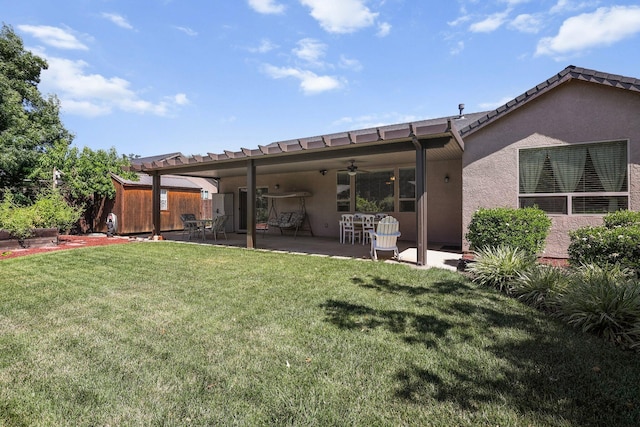 3526 Humbug Dr, Anderson, CA 96007 - back of property with ceiling fan, a patio area, and stucco siding