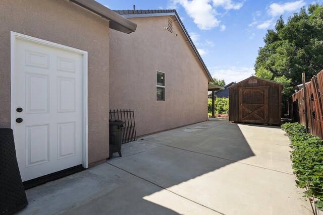 3526 Humbug Dr, Anderson, CA 96007 - view of patio featuring a storage unit
