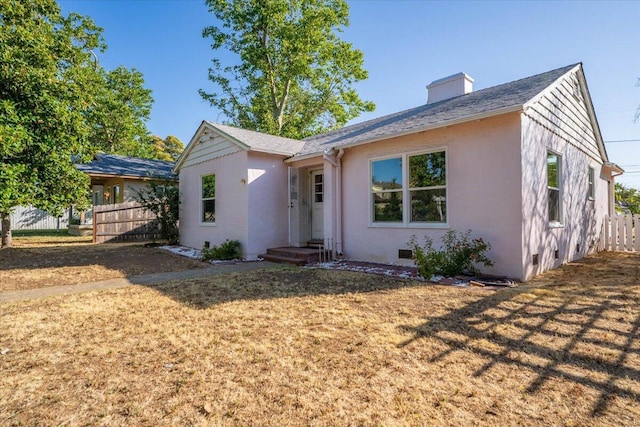 1120 Franklin St, Red Bluff, CA 96080 - view of front facade featuring stucco siding and a chimney