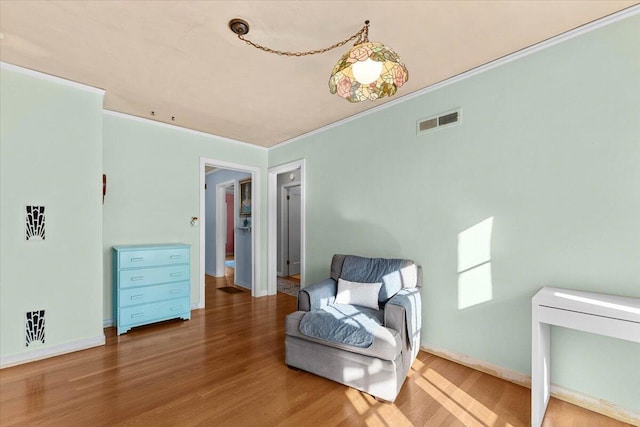 1120 Franklin St, Red Bluff, CA 96080 - sitting room with ornamental molding and wood finished floors