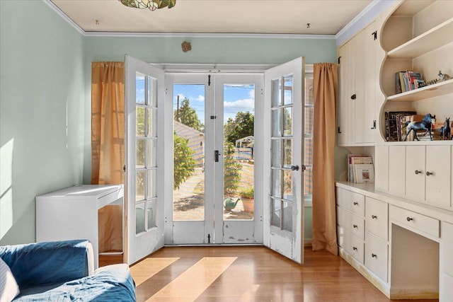 1120 Franklin St, Red Bluff, CA 96080 - entryway with french doors, ornamental molding, and light wood finished floors