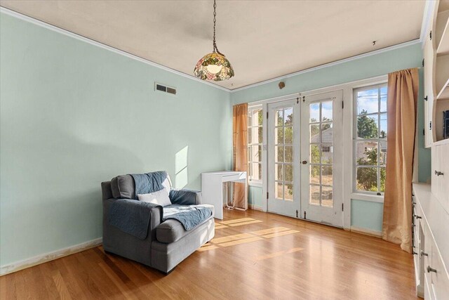 1120 Franklin St, Red Bluff, CA 96080 - sitting room with french doors, ornamental molding, and wood finished floors