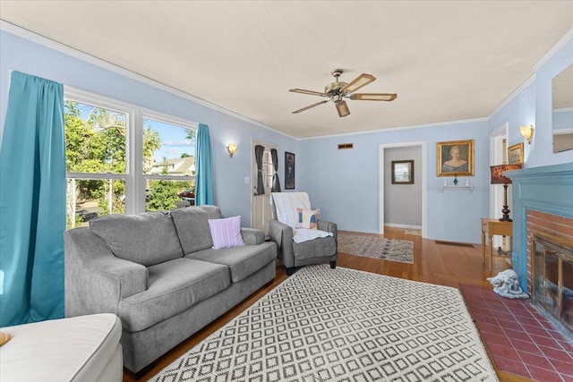 1120 Franklin St, Red Bluff, CA 96080 - living area with a brick fireplace, crown molding, a ceiling fan, and wood finished floors