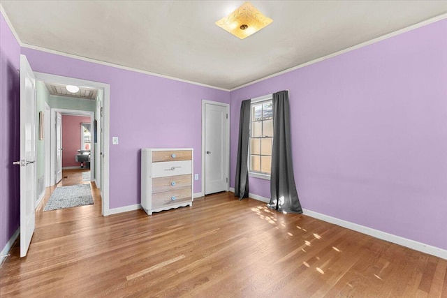 1120 Franklin St, Red Bluff, CA 96080 - unfurnished bedroom with light wood-type flooring and ornamental molding