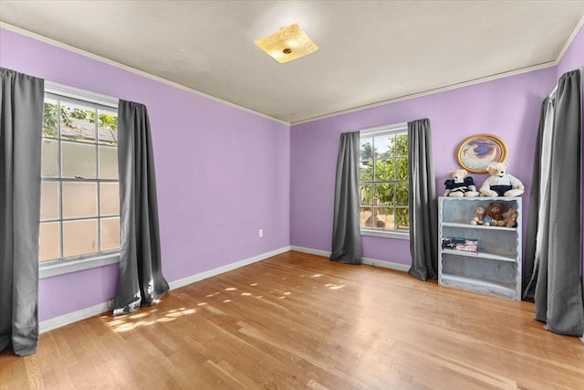 1120 Franklin St, Red Bluff, CA 96080 - unfurnished room with plenty of natural light, wood finished floors, and ornamental molding