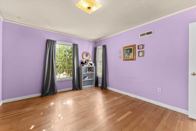 1120 Franklin St, Red Bluff, CA 96080 - unfurnished room with crown molding and wood finished floors