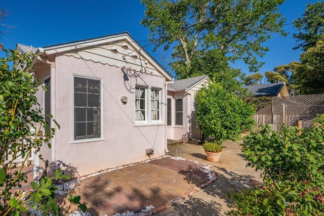 1120 Franklin St, Red Bluff, CA 96080 - view of home's exterior featuring stucco siding and a patio