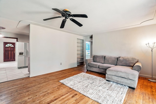 19078 Gravel Plant Rd, Redding, CA 96002 - living area featuring a ceiling fan, light wood-type flooring, and built in shelves