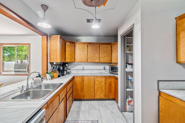 19078 Gravel Plant Rd, Redding, CA 96002 - kitchen featuring light countertops, stainless steel microwave, light marble finish flooring, and brown cabinets