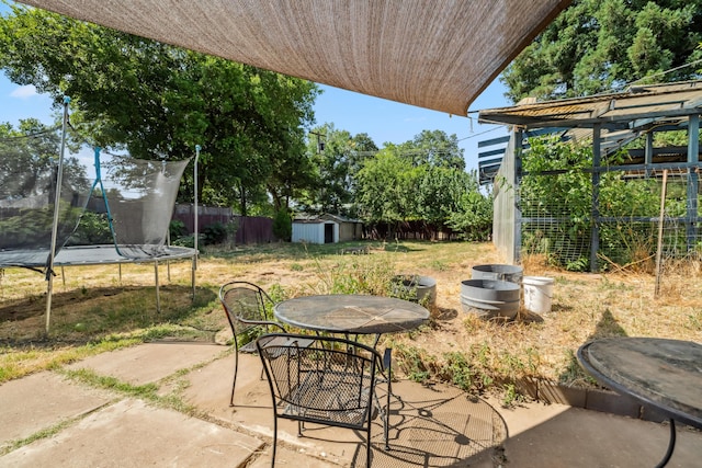 19078 Gravel Plant Rd, Redding, CA 96002 - view of patio featuring a trampoline, a shed, and outdoor dining area