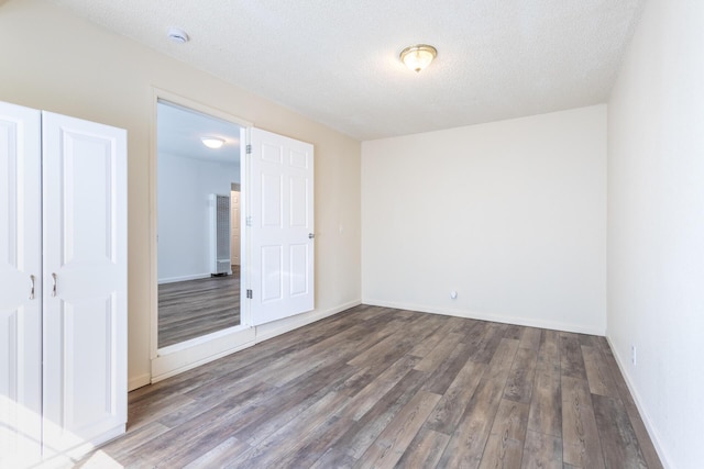 3252 Daisy St, Anderson, CA 96007 - unfurnished bedroom featuring wood finished floors and a textured ceiling