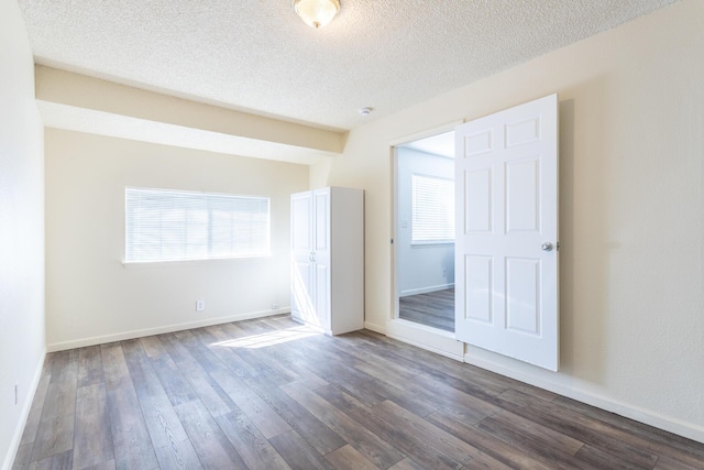 3252 Daisy St, Anderson, CA 96007 - spare room featuring dark wood-type flooring and a textured ceiling