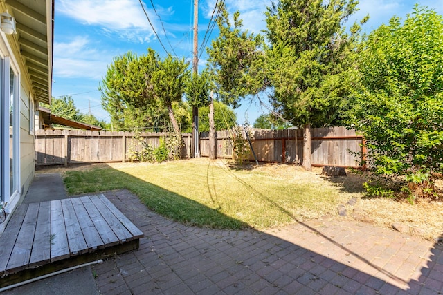 3252 Daisy St, Anderson, CA 96007 - fenced backyard with a patio and a wooden deck