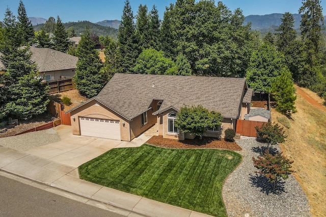 2926 Chaucer Way, Shasta Lake, CA 96019 - view of front facade featuring concrete driveway, stucco siding, an attached garage, and a mountain view